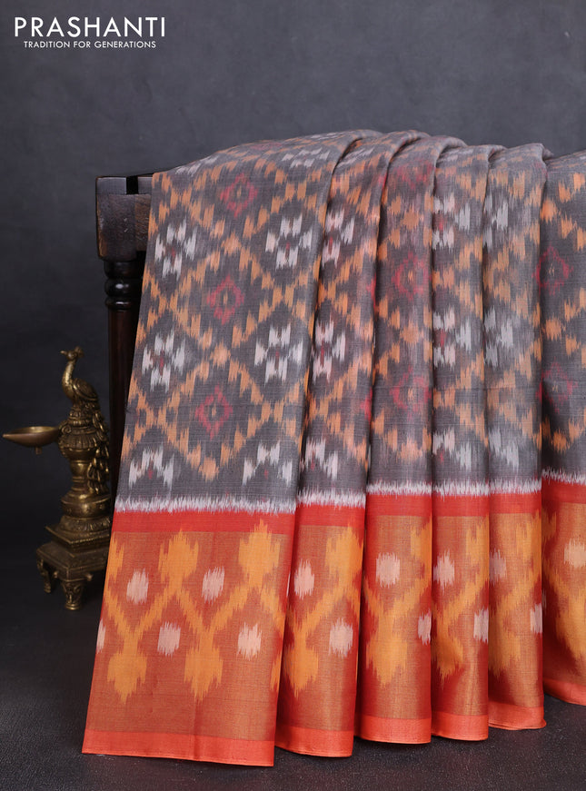 Ikat silk cotton saree grey and orange with allover ikat weaves and long ikat woven zari border