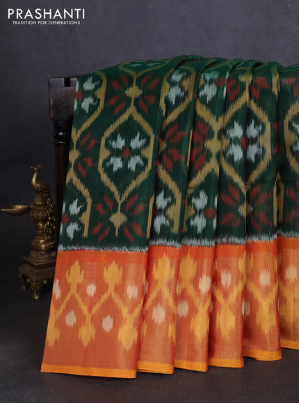 Ikat silk cotton saree bottle green and mustard yellow with allover ikat weaves and long ikat woven zari border