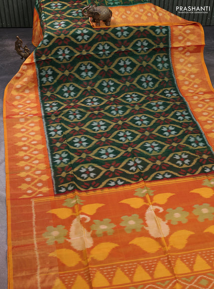 Ikat silk cotton saree bottle green and mustard yellow with allover ikat weaves and long ikat woven zari border