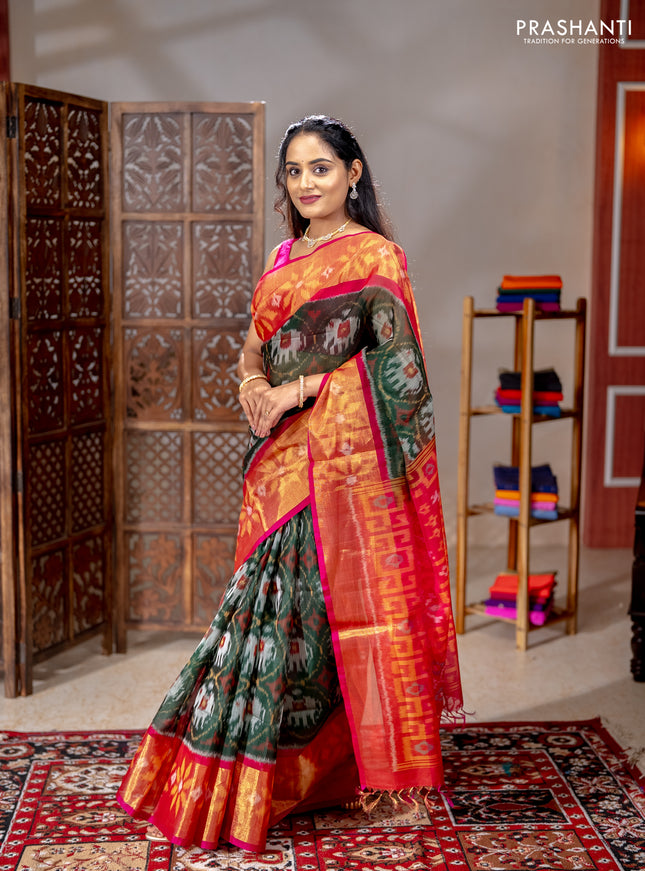 Ikat silk cotton saree bottle green and pink with allover ikat weaves and long ikat woven zari border
