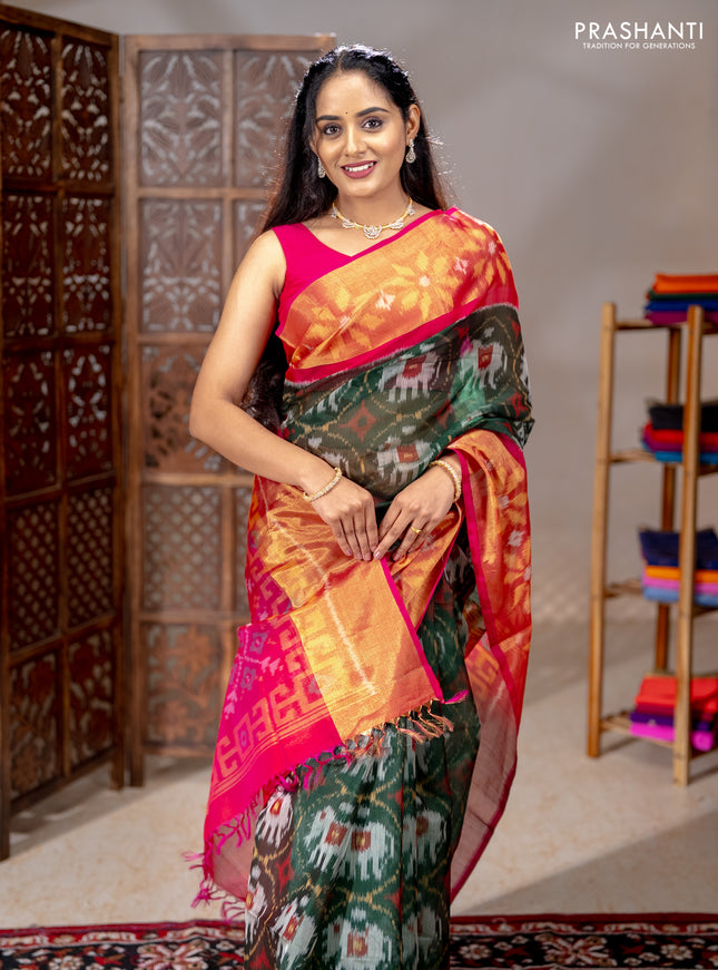 Ikat silk cotton saree bottle green and pink with allover ikat weaves and long ikat woven zari border