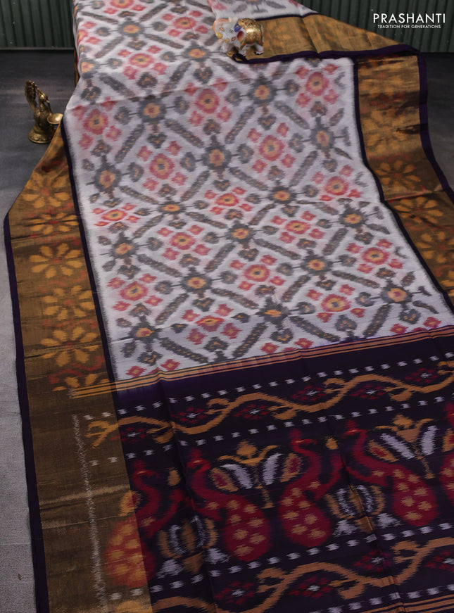 Ikat silk cotton saree off white and violet with allover ikat weaves and long ikat woven zari border