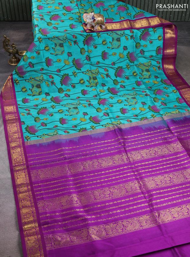 Silk cotton saree teal green and purple with allover pichwai prints and korvai zari woven border