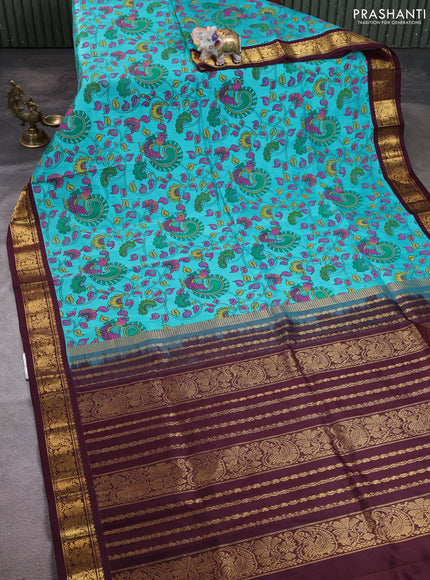 Silk cotton saree teal blue and coffee brown with allover kalamkari prints and korvai zari woven border