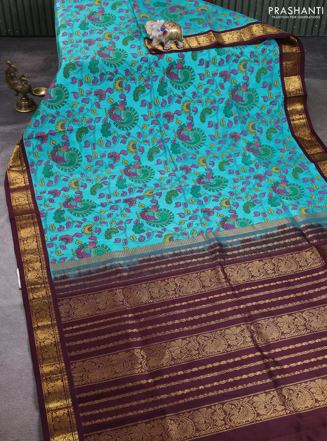 Silk cotton saree teal blue and coffee brown with allover kalamkari prints and korvai zari woven border
