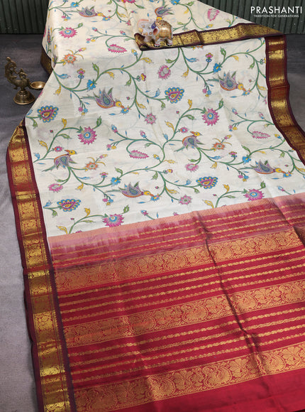 Silk cotton saree cream and deep maroon with allover kalamkari prints and korvai zari woven border