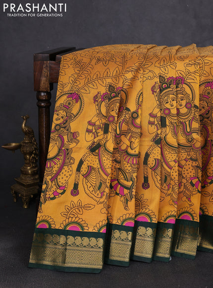 Silk cotton saree mustard yellow and bottle green with allover kalamkari prints and korvai zari woven border