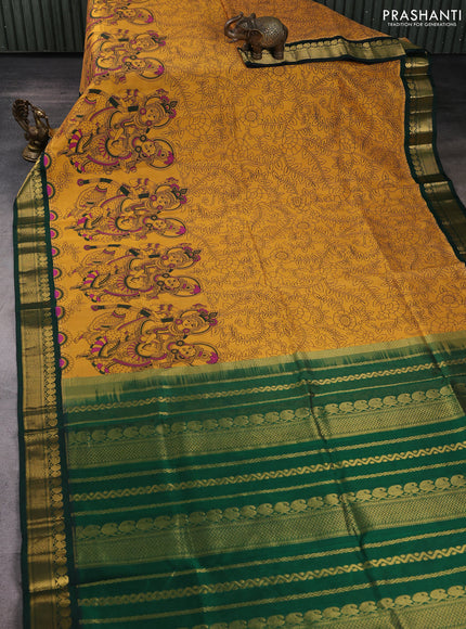 Silk cotton saree mustard yellow and bottle green with allover kalamkari prints and korvai zari woven border