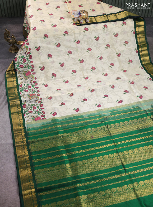 Silk cotton saree cream and bottle green with allover kalamkari prints and korvai zari woven border