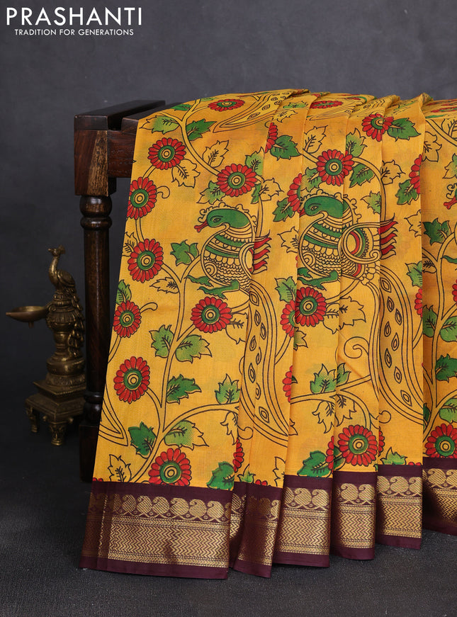 Silk cotton saree mustard yellow and deep maroon with allover kalamkari prints and korvai zari woven border