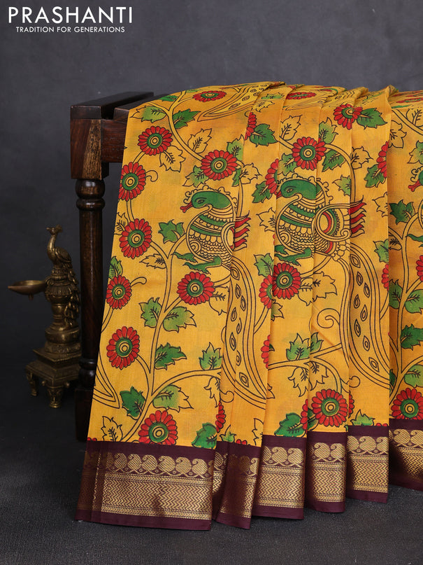 Silk cotton saree mustard yellow and deep maroon with allover kalamkari prints and korvai zari woven border