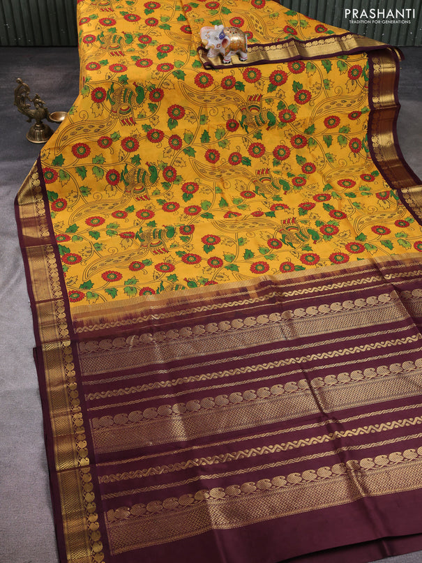Silk cotton saree mustard yellow and deep maroon with allover kalamkari prints and korvai zari woven border