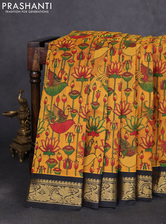 Silk cotton saree mustard yellow and black with allover kalamkari prints and korvai zari woven border