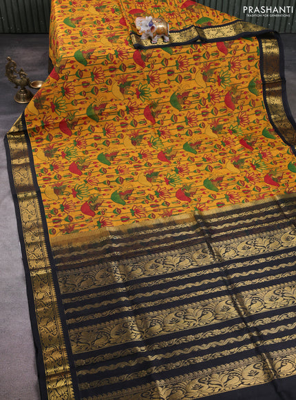 Silk cotton saree mustard yellow and black with allover kalamkari prints and korvai zari woven border