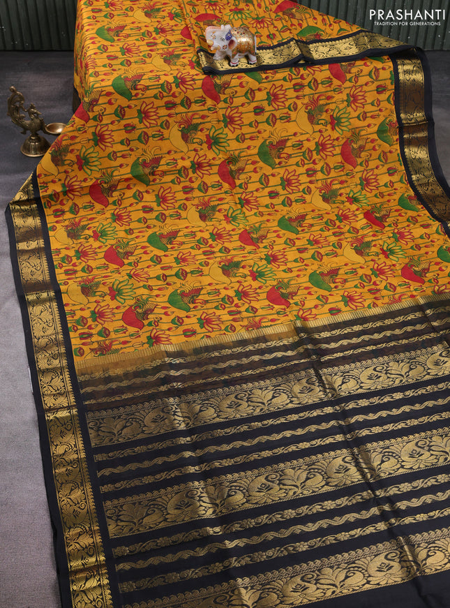 Silk cotton saree mustard yellow and black with allover kalamkari prints and korvai zari woven border