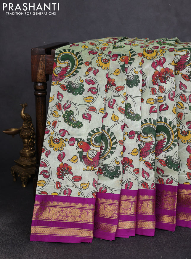 Silk cotton saree mild pista green and purple with allover kalamkari prints and korvai zari woven border
