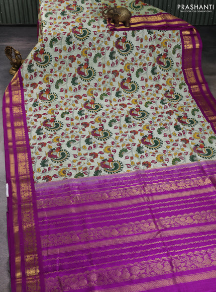 Silk cotton saree mild pista green and purple with allover kalamkari prints and korvai zari woven border