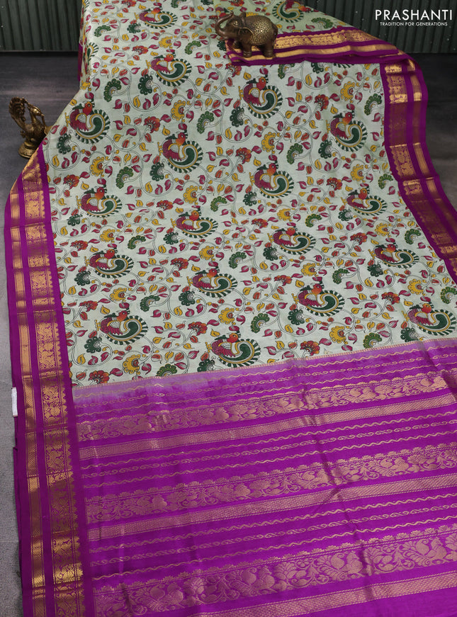 Silk cotton saree mild pista green and purple with allover kalamkari prints and korvai zari woven border