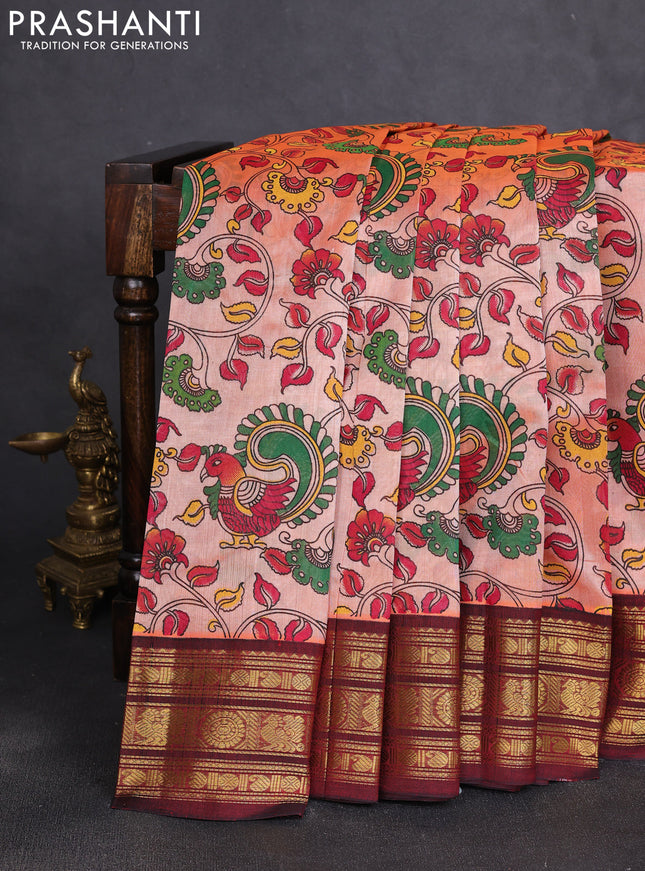 Silk cotton saree peach orange and deep maroon with allover kalamkari prints and korvai zari woven border