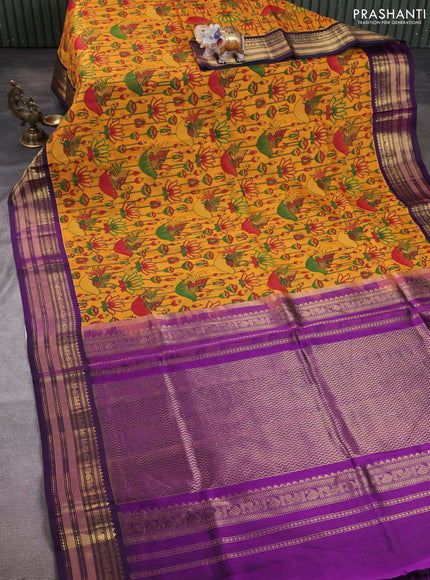 Silk cotton saree mustard yellow and purple with allover kalamkari prints and korvai zari woven border