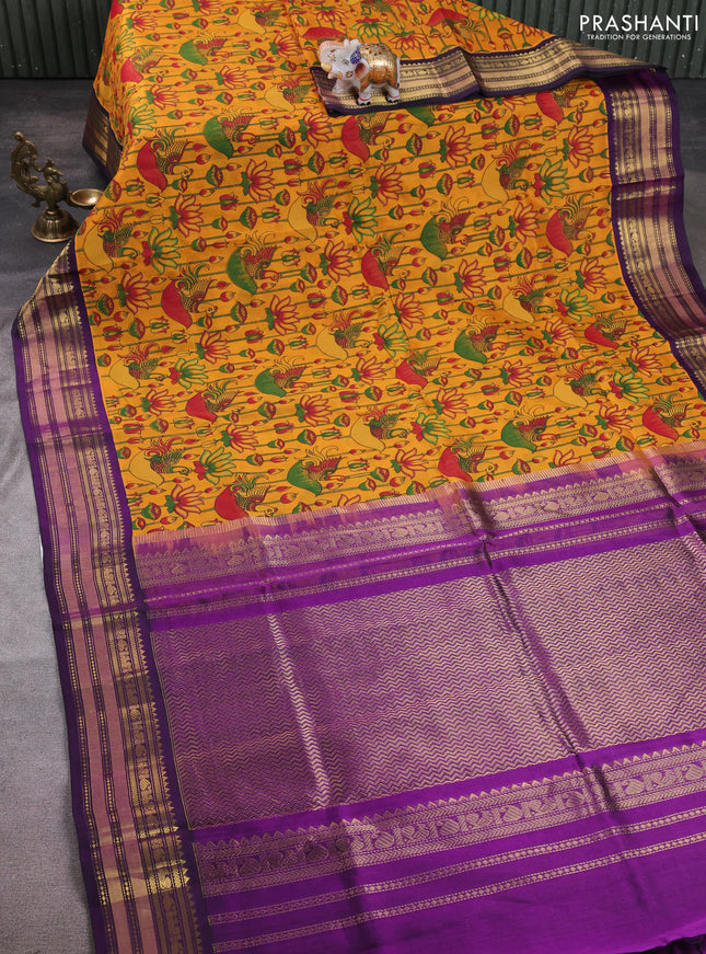 Silk cotton saree mustard yellow and purple with allover kalamkari prints and korvai zari woven border