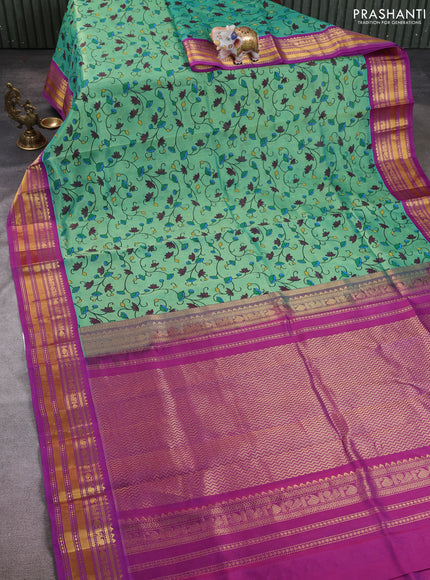 Silk cotton saree teal green and purple with allover kalamkari prints and korvai zari woven border
