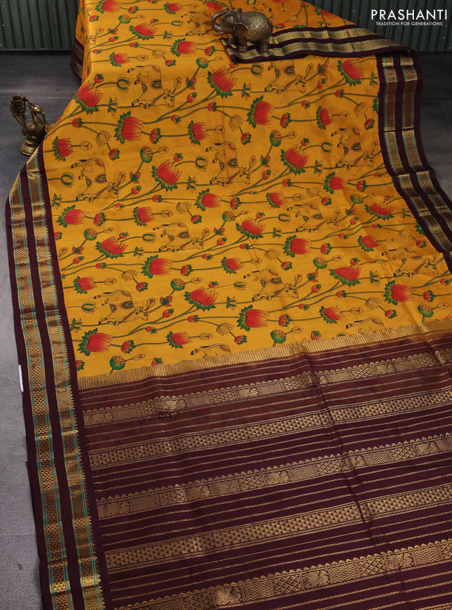 Silk cotton saree mustard yellow and coffee brown with allover pichwai prints and korvai zari woven border