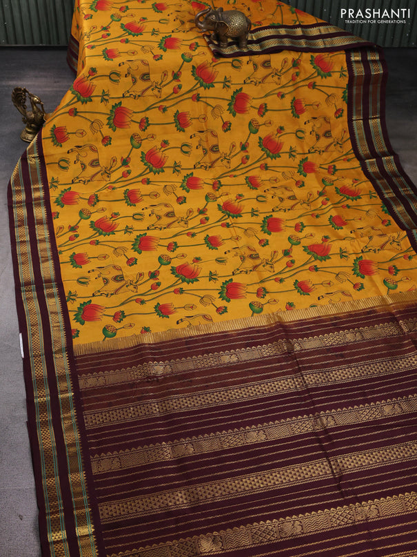 Silk cotton saree mustard yellow and coffee brown with allover pichwai prints and korvai zari woven border