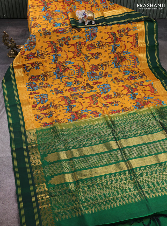 Silk cotton saree mustard yellow and bottle green with allover kalamkari prints and korvai zari woven border