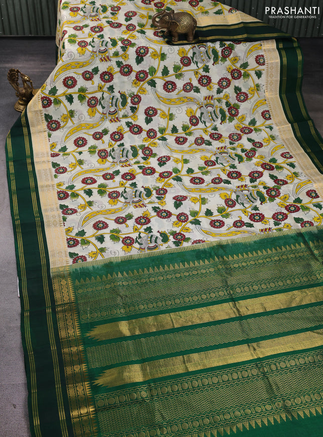 Silk cotton saree cream and bottle green with allover kalamkari prints and korvai zari woven border