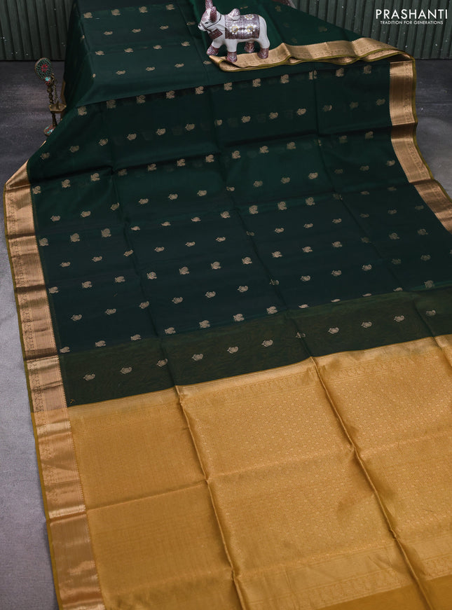 Kora silk cotton saree dark green and dark mustard with paisley & annam zari woven buttas and zari woven border