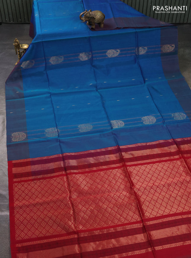 Kora silk cotton saree dual shade of bluish green and reddish pink with allover zari weaves & buttas and zari woven butta border
