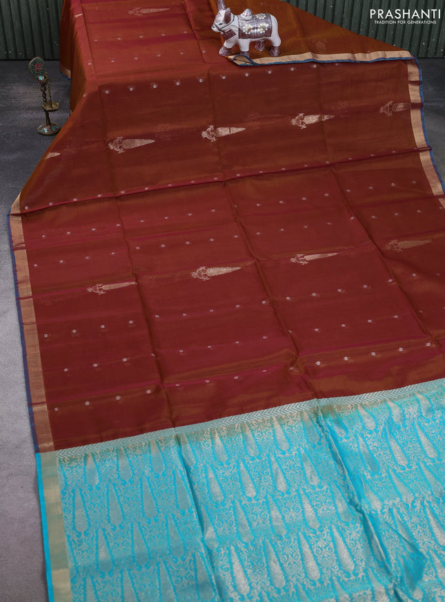 Kora silk cotton saree honey shade and teal blue with allover silver zari woven buttas and zari woven border