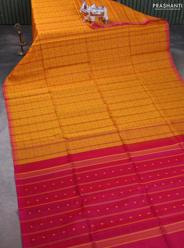 Kora silk cotton saree mango yellow and pink with allover checks & thread buttas and simple border