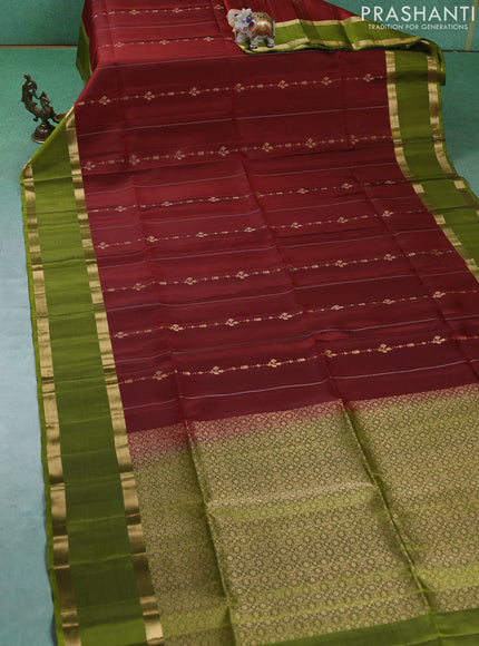 Pure soft silk saree maroon and mehendi green with allover silver & gold zari weaves and rettapet zari woven border