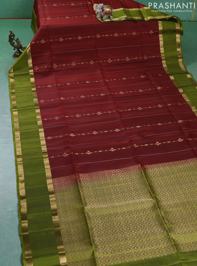 Pure soft silk saree maroon and mehendi green with allover silver & gold zari weaves and rettapet zari woven border