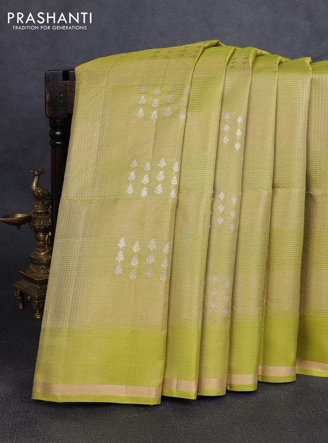 Pure soft silk saree pista green with allover zari checks & buttas and zari woven piping border