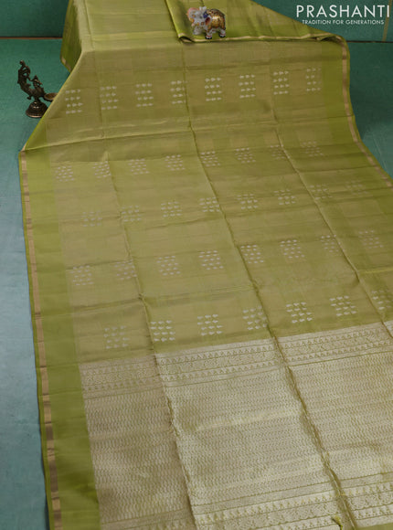 Pure soft silk saree pista green with allover zari checks & buttas and zari woven piping border