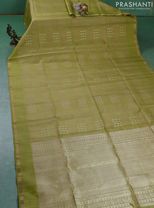 Pure soft silk saree pista green with allover zari checks & buttas and zari woven piping border