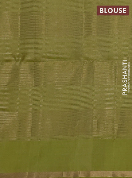 Pure soft silk saree pista green with allover zari checks & buttas and zari woven piping border