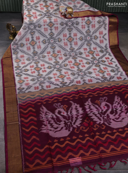 Ikat silk cotton saree off white and wine shade with allover ikat weaves and zari woven border