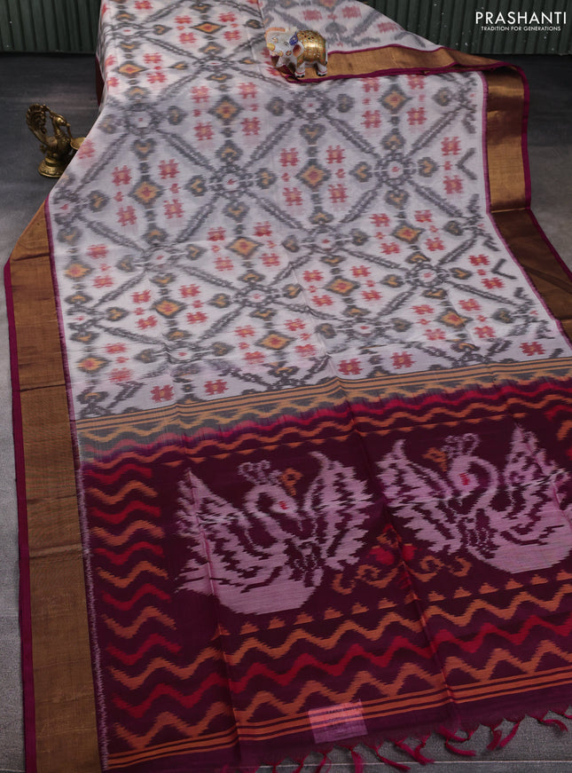 Ikat silk cotton saree off white and wine shade with allover ikat weaves and zari woven border