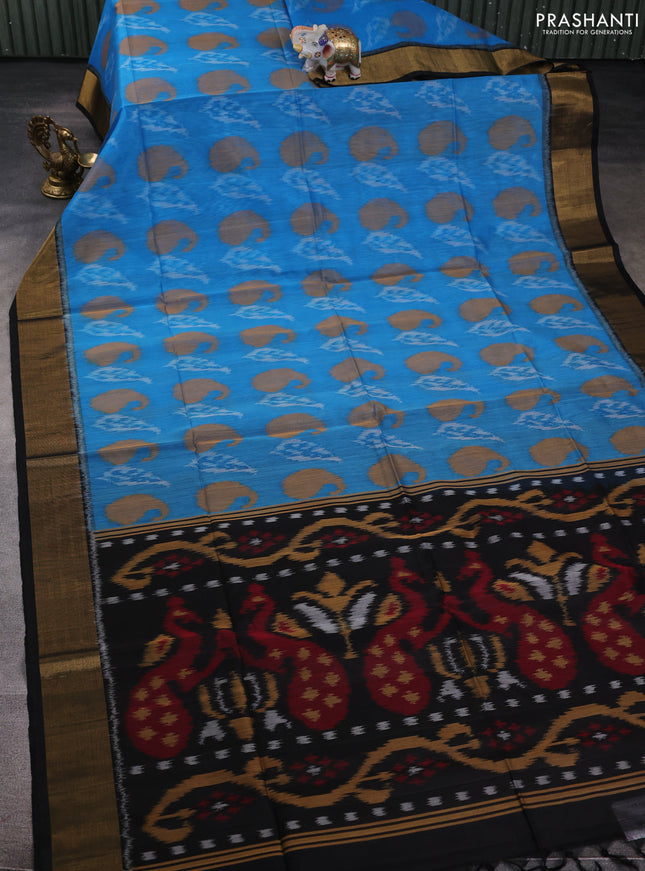 Ikat silk cotton saree light blue and black with allover ikat weaves and zari woven border