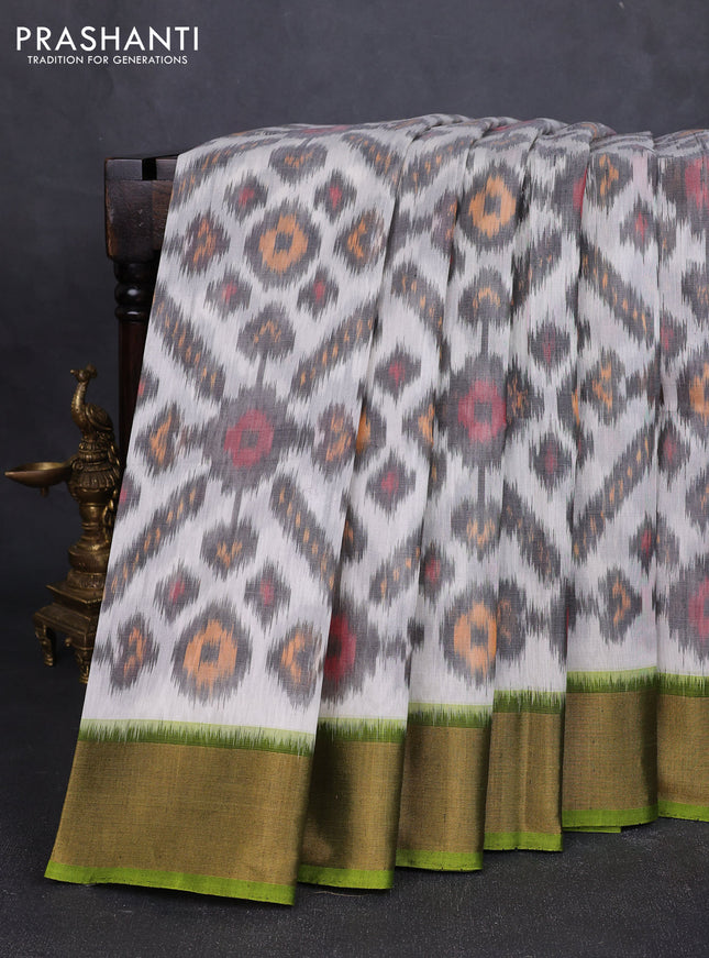 Ikat silk cotton saree off white and light green with allover ikat weaves and zari woven border