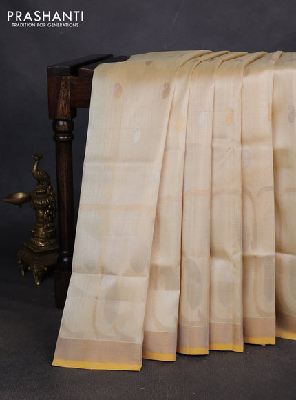 Pure uppada silk saree cream with allover paisley zari woven buttas and zari woven border