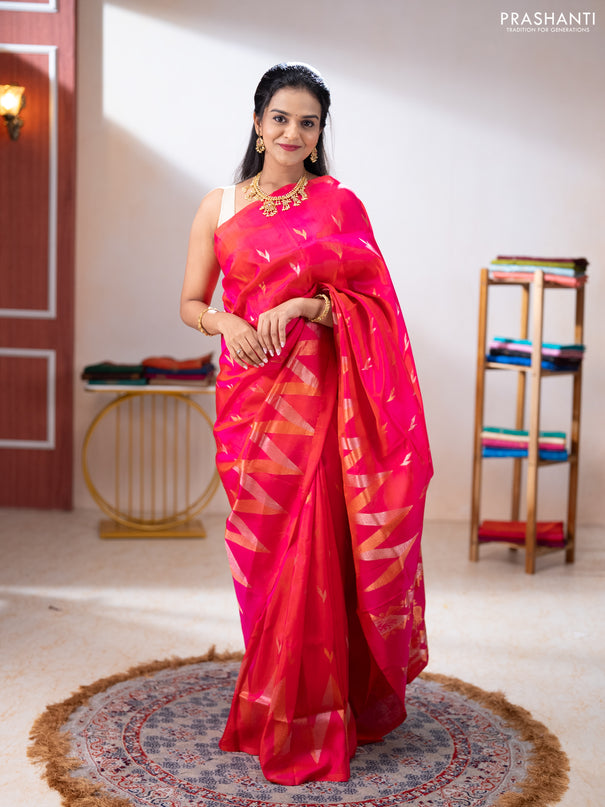 Pure uppada silk saree dual shade of pinkish orange with allover silver & zari woven buttas and long zari zigzag border