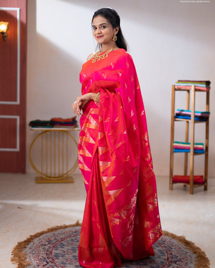Pure uppada silk saree dual shade of pinkish orange with allover silver & zari woven buttas and long zari zigzag border