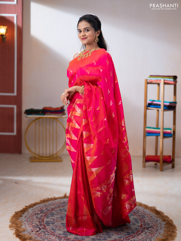 Pure uppada silk saree dual shade of pinkish orange with allover silver & zari woven buttas and long zari zigzag border