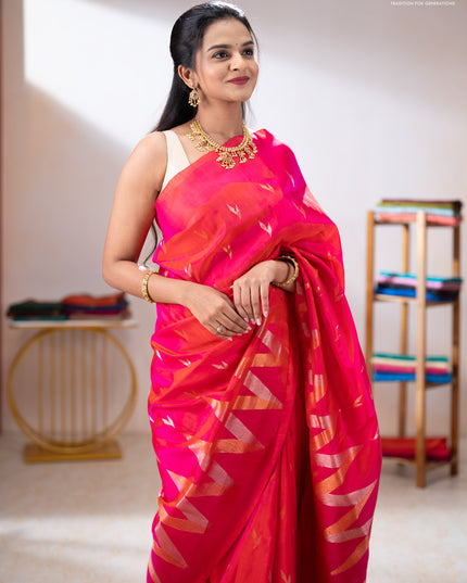 Pure uppada silk saree dual shade of pinkish orange with allover silver & zari woven buttas and long zari zigzag border