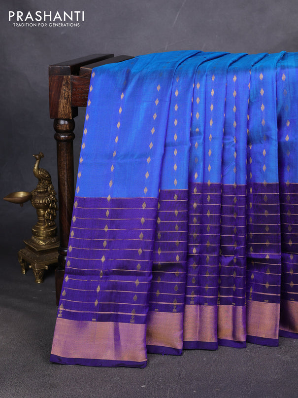 Pure uppada silk saree cs blue and blue with allover zari woven buttas and long zari woven butta border